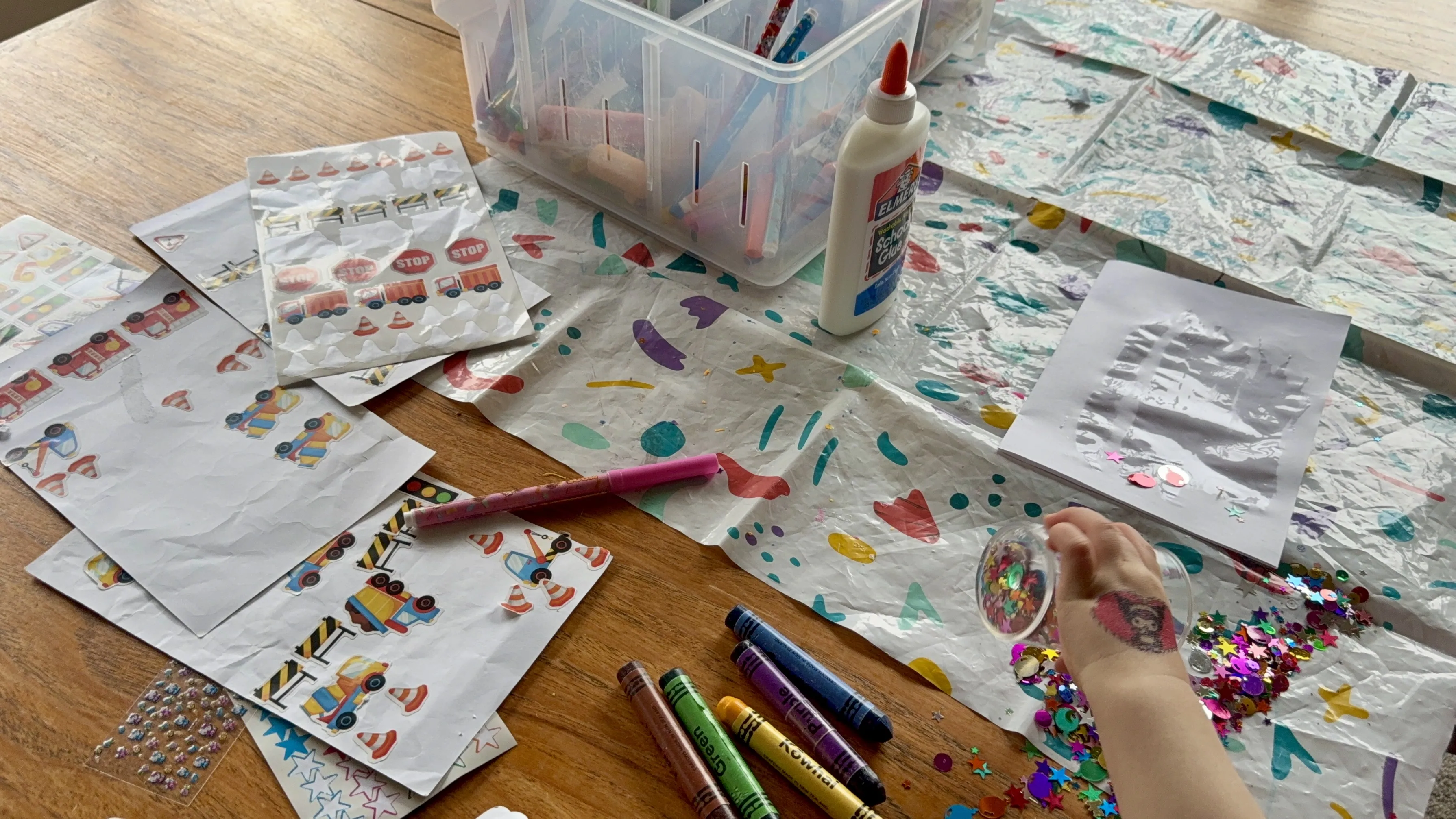 Years of children’s drawings organised into folders, memory boxes and digital copies