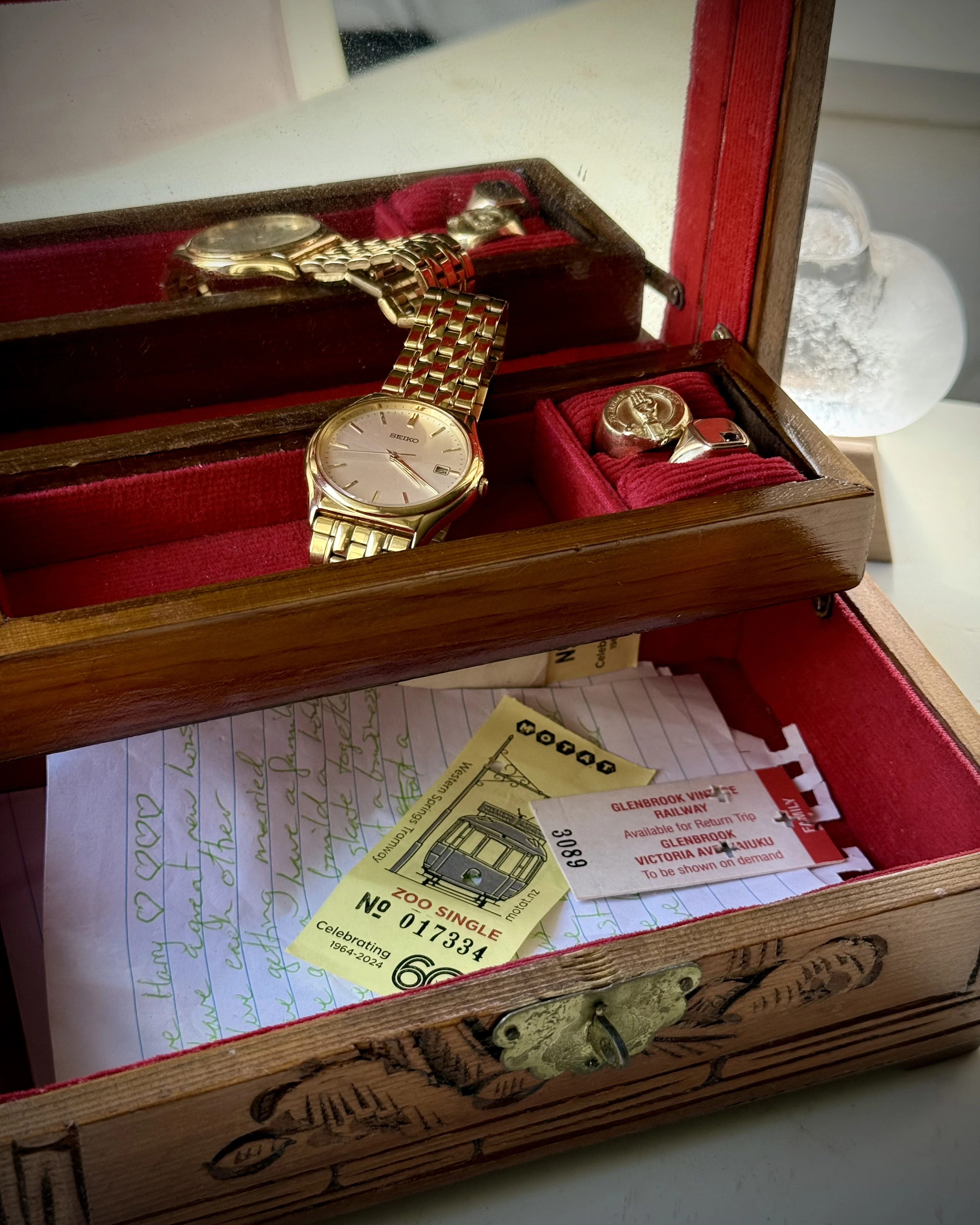 Children's artwork, handwritten cards and family keepsakes arranged privately at home